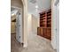 Hallway featuring a built-in wooden bookcase and neutral carpet at 1069 Eagles Brooke Dr, Locust Grove, GA 30248