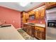 Kitchen featuring wooden cabinets, stainless steel appliances, and tile flooring at 1069 Eagles Brooke Dr, Locust Grove, GA 30248