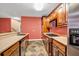 Kitchen featuring wooden cabinets, stainless steel appliances, and tile flooring at 1069 Eagles Brooke Dr, Locust Grove, GA 30248