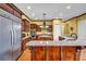 Kitchen featuring stainless steel appliances, a large island, and granite countertops at 1069 Eagles Brooke Dr, Locust Grove, GA 30248