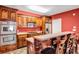 Kitchen featuring wooden cabinets, stainless steel appliances, and tile flooring at 1069 Eagles Brooke Dr, Locust Grove, GA 30248