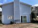 Backyard exterior with sliding door and brick patio at 1454 Walnut Log Pl, Austell, GA 30168