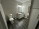 Well-lit bathroom with vanity, granite countertop, and modern mirror at 1454 Walnut Log Pl, Austell, GA 30168