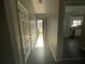 Hallway with tile floors and view into the kitchen at 1454 Walnut Log Pl, Austell, GA 30168