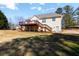 View of the home's spacious backyard with a large deck, perfect for outdoor entertaining and relaxation at 151 Berkshire Dr, Hiram, GA 30141