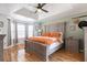 This large bedroom is a relaxing retreat with hard wood floors and tray ceilings at 151 Berkshire Dr, Hiram, GA 30141