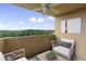 Private balcony with comfortable seating, ceiling fan, and serene views of the surrounding landscape at 1501 Clairmont Rd # 1318, Decatur, GA 30033