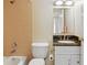 Bathroom featuring granite countertop vanity, mirror, and shower-tub combination at 1501 Clairmont Rd # 1318, Decatur, GA 30033