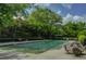 Community pool and sun deck with lounge chairs and tables surrounded by lush landscaping at 1501 Clairmont Rd # 1318, Decatur, GA 30033