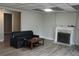 Inviting living room features modern floors, a decorative fireplace, and a comfortable sofa for relaxation and entertaining at 3581 Midway Rd, Decatur, GA 30032