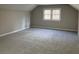 Spacious carpeted bedroom with fresh paint and a large window offering ample natural light at 5073 Willow Point Pkwy, Marietta, GA 30068