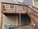 Wooden deck with railings and stairs at rear of home, door to basement storage at 5073 Willow Point Pkwy, Marietta, GA 30068