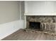 Rustic stone fireplace with built-in shelves and white wood paneling at 5073 Willow Point Pkwy, Marietta, GA 30068