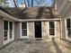Front entrance of home with stone pathway and large windows on either side of the front door at 5073 Willow Point Pkwy, Marietta, GA 30068