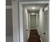 Hallway with recessed lighting, dark wood floors, and access to rooms at 5073 Willow Point Pkwy, Marietta, GA 30068