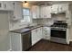 Well-lit kitchen featuring modern appliances, white cabinets, and ample counter space at 5073 Willow Point Pkwy, Marietta, GA 30068
