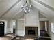 Living room with stone fireplace, hardwood floors, and white ceiling beams at 5073 Willow Point Pkwy, Marietta, GA 30068