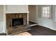 Living room with stone fireplace, hardwood floors, and white wainscoting at 5073 Willow Point Pkwy, Marietta, GA 30068