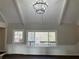 Bright living room with new lighting, wood floors, paneled wainscoting and view to outdoors at 5073 Willow Point Pkwy, Marietta, GA 30068