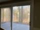 Sliding glass patio door grants access to a concrete patio and backyard views at 5073 Willow Point Pkwy, Marietta, GA 30068