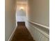 Wood staircase with white handrail leading to the lower level at 5073 Willow Point Pkwy, Marietta, GA 30068