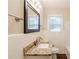 Bathroom features granite counters, white tile, and framed mirror at 5130 Cornwallis Ct, Stone Mountain, GA 30088