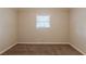 Bedroom featuring neutral walls, carpet, and a window at 5130 Cornwallis Ct, Stone Mountain, GA 30088