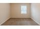 Bedroom showcasing plush carpet, neutral walls, and ample natural light at 5130 Cornwallis Ct, Stone Mountain, GA 30088