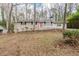 Ranch-style home features a red front door and a white porch railing at 5130 Cornwallis Ct, Stone Mountain, GA 30088