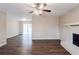 Open living room with hardwood floors flowing between fireplace and sliding doors at 5130 Cornwallis Ct, Stone Mountain, GA 30088