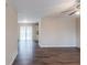 Bright living room features dark wood floors and sliding glass doors at 5130 Cornwallis Ct, Stone Mountain, GA 30088