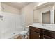 Bathroom featuring a tub and shower combo, toilet, and vanity with a sink at 6040 Oakley Rd, Union City, GA 30291