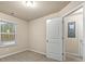 Bedroom featuring carpeted floors, neutral walls, and a window at 6040 Oakley Rd, Union City, GA 30291