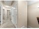 Upstairs hallway with carpeted floors, neutral walls, and white doors, leading to various rooms at 6040 Oakley Rd, Union City, GA 30291