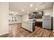 Modern kitchen featuring stainless steel appliances and an island with granite countertops at 6040 Oakley Rd, Union City, GA 30291