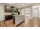 A kitchen features an island, granite countertops, stainless appliances and dark wood cabinets at 6040 Oakley Rd, Union City, GA 30291