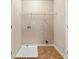 Neutral laundry room with a white wire shelf, washing machine outlet, and neutral-colored flooring at 6040 Oakley Rd, Union City, GA 30291