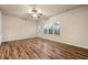 Bright living room with hardwood floors, large window, and a doorway to the outside at 6040 Oakley Rd, Union City, GA 30291
