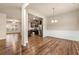 Open-concept living room with hardwood floors and a view into the kitchen at 6040 Oakley Rd, Union City, GA 30291