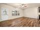Open living area with wood floors, ceiling fan, and natural light at 6040 Oakley Rd, Union City, GA 30291
