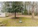 Spacious backyard featuring mature trees, a shed and natural surroundings at 8673 Chestnut Ln, Lithia Springs, GA 30122