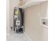 The laundry area includes a water heater and shelving at 8673 Chestnut Ln, Lithia Springs, GA 30122