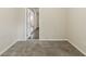 Neutral bedroom with carpeting, and white door leading to other rooms with hardwood at 8673 Chestnut Ln, Lithia Springs, GA 30122