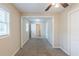 Neutral bedroom with carpeting, window with blinds, ceiling fan, and connecting rooms at 8673 Chestnut Ln, Lithia Springs, GA 30122