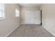 Comfortable bedroom with neutral carpeting and spacious closet at 8673 Chestnut Ln, Lithia Springs, GA 30122