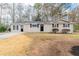 Charming ranch-style home with a well-maintained lawn and inviting curb appeal at 8673 Chestnut Ln, Lithia Springs, GA 30122