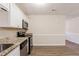 Well-equipped kitchen with stainless steel appliances and granite countertops at 8673 Chestnut Ln, Lithia Springs, GA 30122