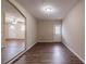Open floor plan with wood-look flooring and seamless flow between spaces at 8673 Chestnut Ln, Lithia Springs, GA 30122
