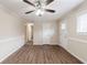 Bright living room featuring modern wood-look floors and neutral wall colors at 8673 Chestnut Ln, Lithia Springs, GA 30122