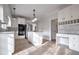 Updated kitchen featuring white cabinets, stainless appliances, granite countertops, and a kitchen island at 12090 Lonsdale Ln, Roswell, GA 30075